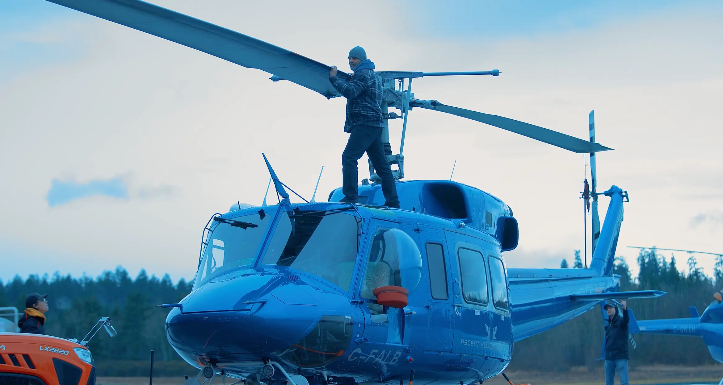 Crew member working on helicopter